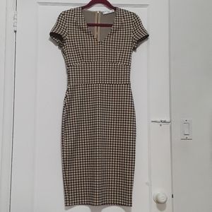 Stretchy, body con dress; back zip, short sleeves